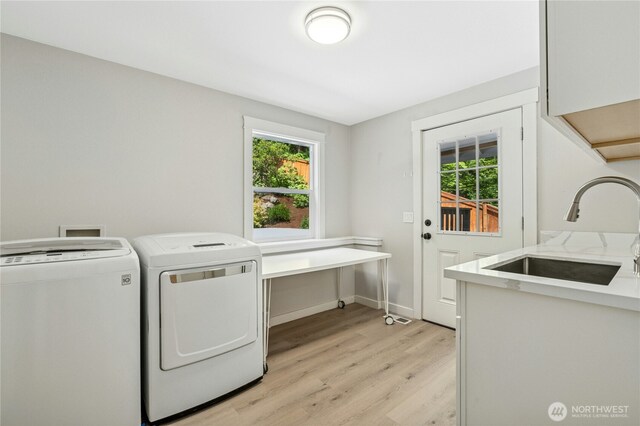 17519 33rd Ave NE, Lake Forest Park, WA 98155 - laundry room with washing machine and dryer, light wood finished floors, and healthy amount of natural light
