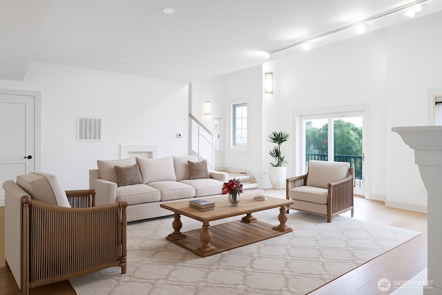 745 Bellevue Ave E Unit 109, Seattle, WA 98102 - living room featuring wood finished floors and stairs
