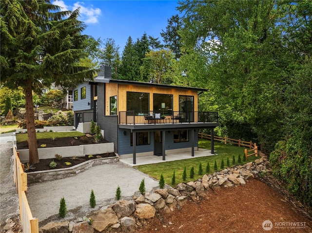 11029 84th Ave S, Seattle, WA 98178 - back of house with a patio area, a lawn, and a wooden deck