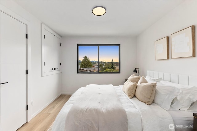 11029 84th Ave S, Seattle, WA 98178 - bedroom featuring light wood-style floors and baseboards