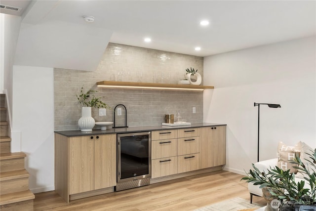 11029 84th Ave S, Seattle, WA 98178 - indoor wet bar featuring wine cooler, tasteful backsplash, stairs, light wood-style flooring, and recessed lighting