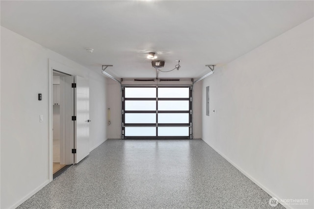 11029 84th Ave S, Seattle, WA 98178 - garage with a garage door opener and electric panel
