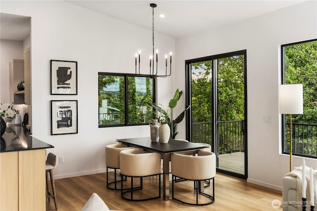11029 84th Ave S, Seattle, WA 98178 - dining area with a chandelier, light wood-style flooring, and recessed lighting