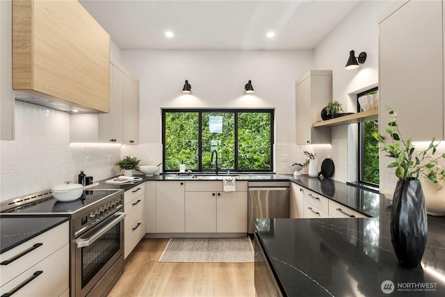 11029 84th Ave S, Seattle, WA 98178 - kitchen featuring appliances with stainless steel finishes, open shelves, light wood finished floors, backsplash, and recessed lighting