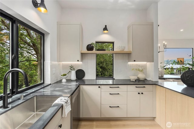11029 84th Ave S, Seattle, WA 98178 - kitchen with open shelves, stainless steel dishwasher, decorative backsplash, modern cabinets, and dark countertops
