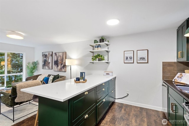 1541 18th Ave S, Seattle, WA 98144 - kitchen with a peninsula, dark wood finished floors, green cabinetry, and tasteful backsplash