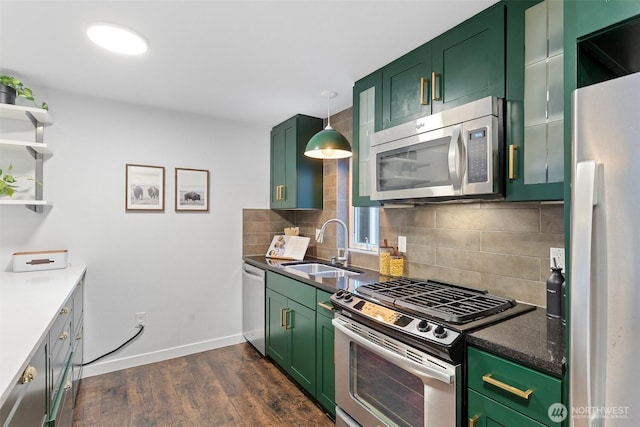 1541 18th Ave S, Seattle, WA 98144 - kitchen featuring appliances with stainless steel finishes, green cabinets, backsplash, and dark wood-type flooring