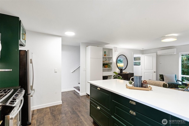 1541 18th Ave S, Seattle, WA 98144 - kitchen with a wall mounted AC, stainless steel appliances, light countertops, dark wood-style flooring, and green cabinetry