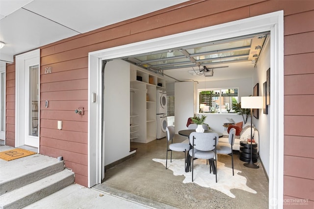 1541 18th Ave S, Seattle, WA 98144 - view of patio / terrace with stacked washer and clothes dryer