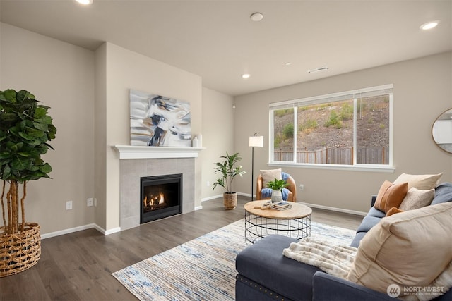 1312 Baker Heights Loop, Bremerton, WA 98312 - living area with wood finished floors, a tiled fireplace, and recessed lighting