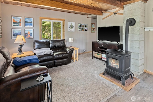 7 Moonshine Ln, Ronald, WA 98940 - living area featuring a wood stove, a wood ceiling with exposed beams, and wood finished floors