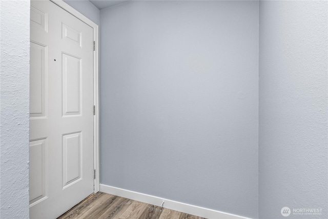 12608 NE 119th St Unit B8, Kirkland, WA 98034 - unfurnished room featuring wood finished floors and baseboards