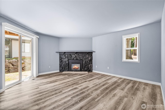 12608 NE 119th St Unit B8, Kirkland, WA 98034 - unfurnished living room with wood finished floors and a fireplace