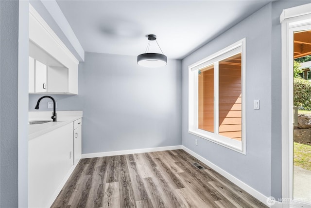 12608 NE 119th St Unit B8, Kirkland, WA 98034 - unfurnished dining area with wood finished floors