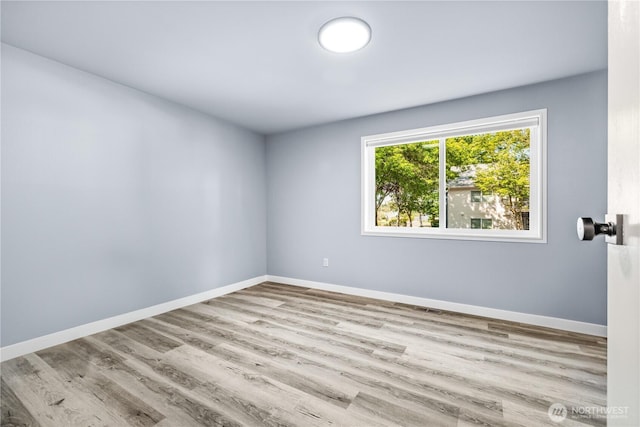 12608 NE 119th St Unit B8, Kirkland, WA 98034 - spare room with wood finished floors and baseboards