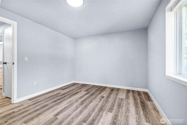 12608 NE 119th St Unit B8, Kirkland, WA 98034 - empty room with light wood finished floors and baseboards