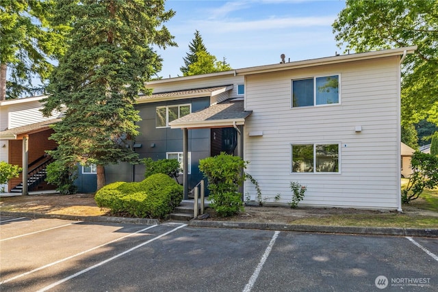 12608 NE 119th St Unit B8, Kirkland, WA 98034 - view of front facade with uncovered parking and stairway