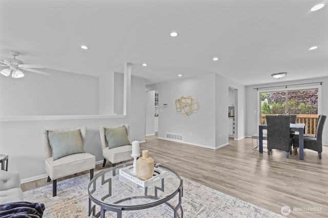 13002 145th St E, Puyallup, WA 98374 - living room with wood finished floors, recessed lighting, and a ceiling fan