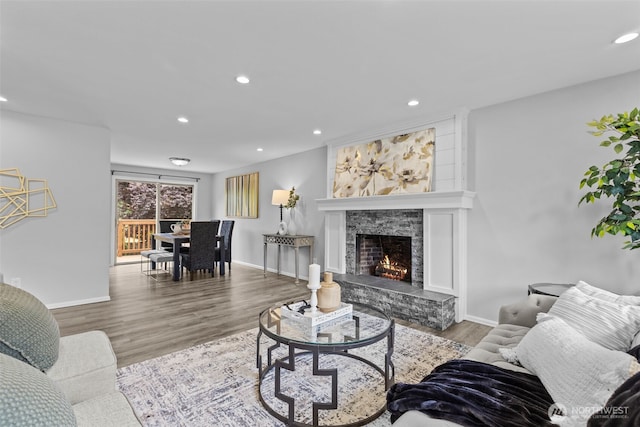 13002 145th St E, Puyallup, WA 98374 - living room featuring recessed lighting, wood finished floors, and a fireplace