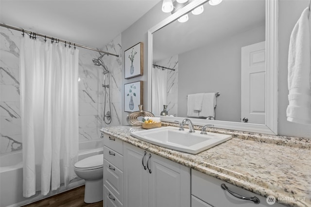 13002 145th St E, Puyallup, WA 98374 - bathroom featuring shower / tub combo with curtain, vanity, and wood finished floors