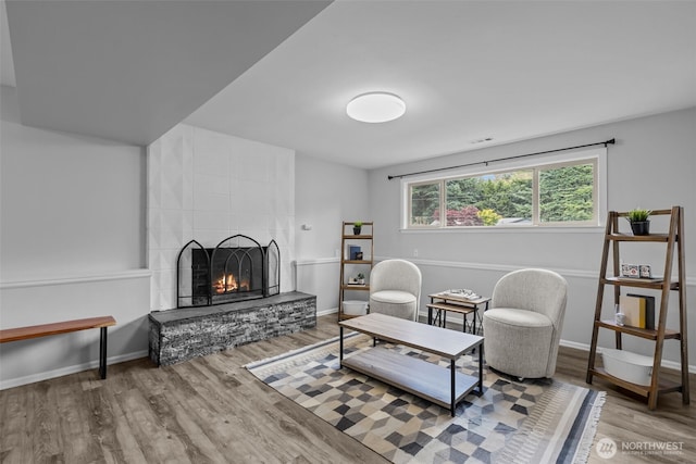13002 145th St E, Puyallup, WA 98374 - living area featuring a large fireplace and wood finished floors