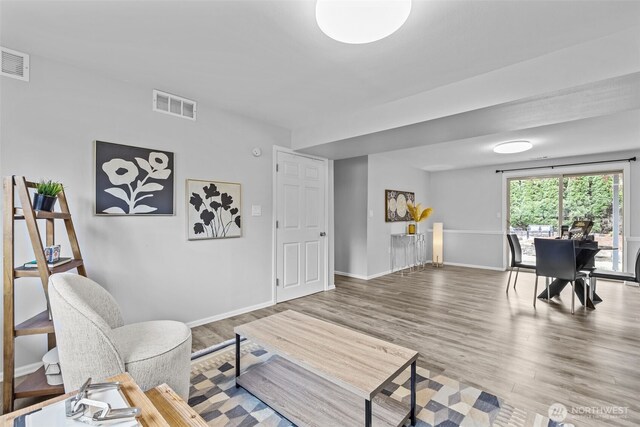 13002 145th St E, Puyallup, WA 98374 - living area featuring wood finished floors and baseboards