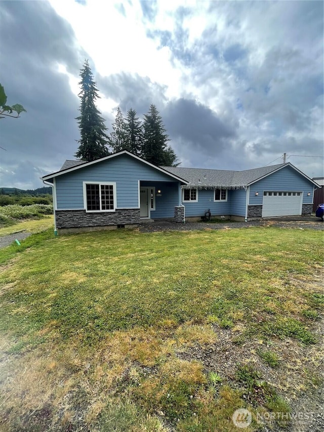 1717 Krause Rd, Raymond, WA 98577 - single story home with an attached garage, a front lawn, and stone siding