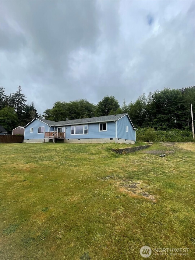 1717 Krause Rd, Raymond, WA 98577 - back of property with crawl space, a yard, and a deck
