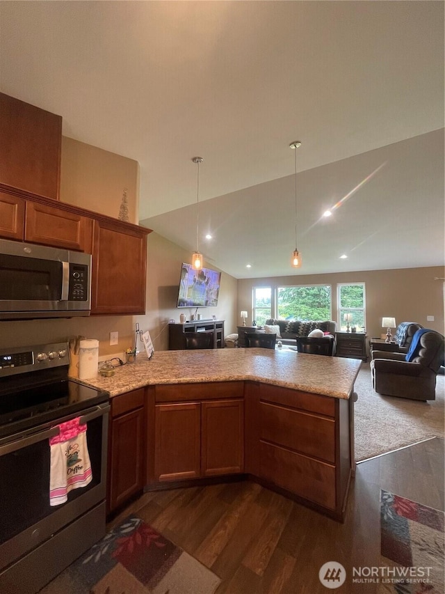 1717 Krause Rd, Raymond, WA 98577 - kitchen featuring range with electric cooktop, stainless steel microwave, open floor plan, a peninsula, and dark wood finished floors