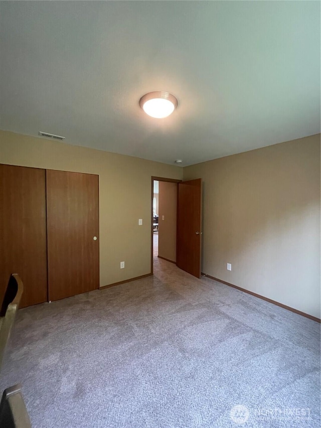 1717 Krause Rd, Raymond, WA 98577 - unfurnished bedroom with light colored carpet and a closet
