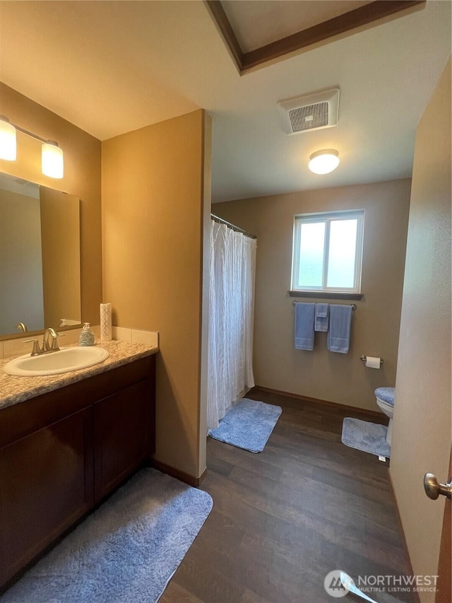 1717 Krause Rd, Raymond, WA 98577 - full bathroom featuring vanity, wood finished floors, and a shower with shower curtain