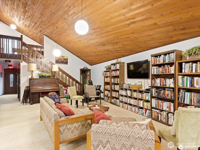 2500 Alder St Unit 335, Milton, WA 98354 - living area featuring carpet, stairs, vaulted ceiling, wooden ceiling, and bookshelves