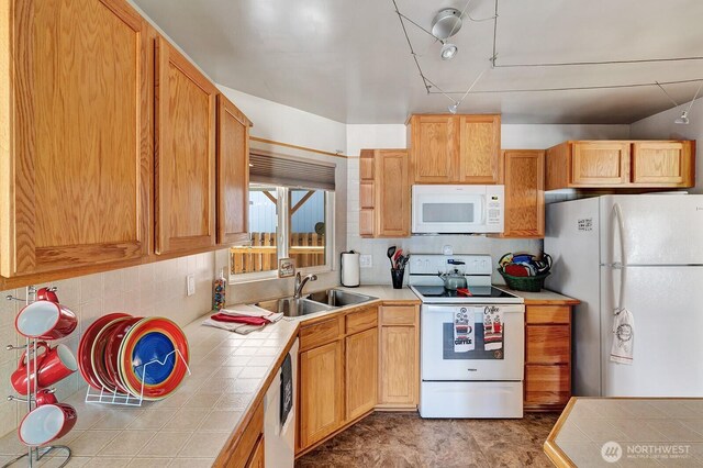 2500 Alder St Unit 335, Milton, WA 98354 - kitchen featuring white appliances, tile countertops, and tasteful backsplash