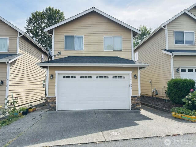 27120 105th Pl SE, Kent, WA 98030 - view of front of property with stone siding, driveway, a garage, and roof with shingles