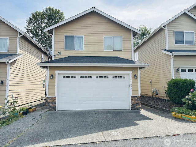27120 105th Pl SE, Kent, WA 98030 - view of front of home with stone siding, asphalt driveway, an attached garage, and roof with shingles