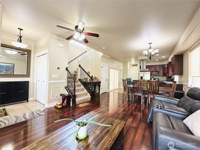 27120 105th Pl SE, Kent, WA 98030 - living area featuring stairs, a chandelier, ceiling fan, and light wood-style floors