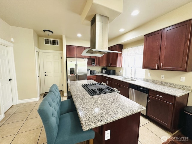 27120 105th Pl SE, Kent, WA 98030 - kitchen with appliances with stainless steel finishes, island range hood, light tile patterned floors, a kitchen breakfast bar, and recessed lighting