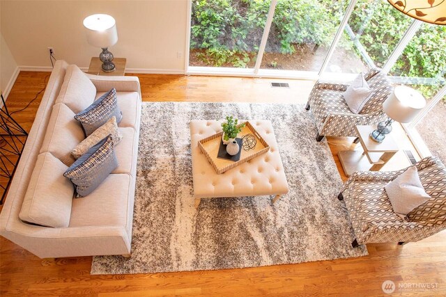 10761 Bill Point Crst NE, Bainbridge Island, WA 98110 - living room featuring wood finished floors and baseboards