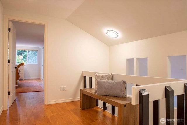 10761 Bill Point Crst NE, Bainbridge Island, WA 98110 - stairway featuring hardwood / wood-style flooring and vaulted ceiling