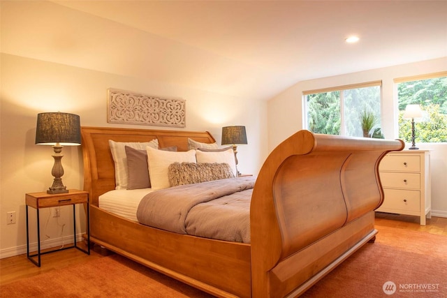 10761 Bill Point Crst NE, Bainbridge Island, WA 98110 - bedroom with lofted ceiling, wood finished floors, and recessed lighting