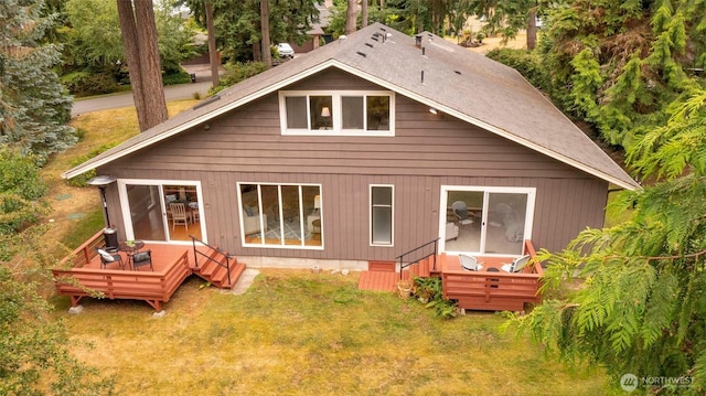 10761 Bill Point Crst NE, Bainbridge Island, WA 98110 - back of property with a wooden deck and a lawn