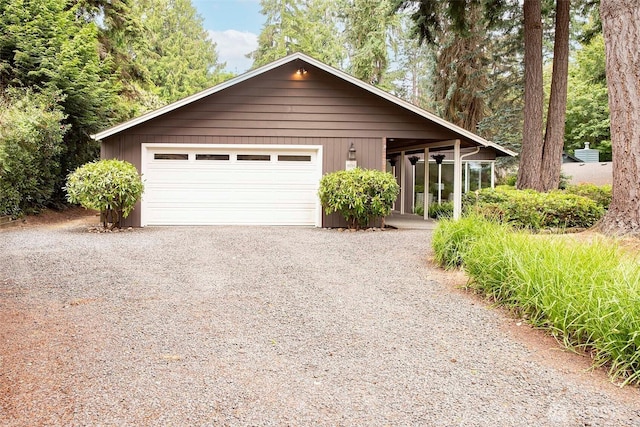 10761 Bill Point Crst NE, Bainbridge Island, WA 98110 - view of front facade with driveway and a garage
