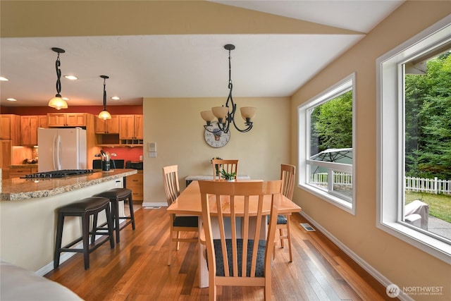 2360 Sapp Rd SW, Tumwater, WA 98512 - dining space with light wood finished floors, plenty of natural light, recessed lighting, a chandelier, and lofted ceiling