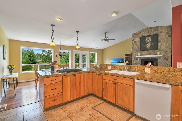 2360 Sapp Rd SW, Tumwater, WA 98512 - kitchen featuring white dishwasher, tile countertops, plenty of natural light, pendant lighting, and vaulted ceiling