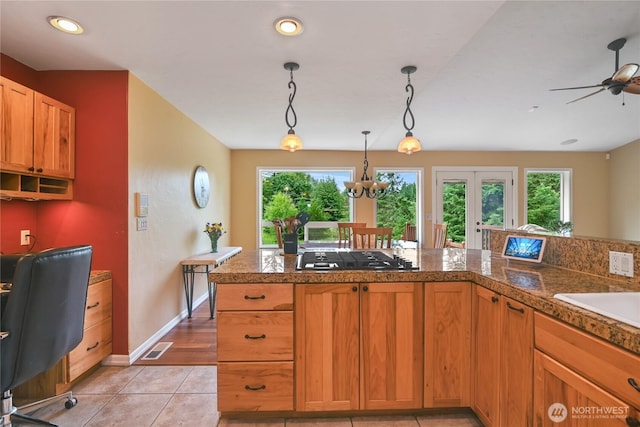 2360 Sapp Rd SW, Tumwater, WA 98512 - kitchen with tile counters, stainless steel gas cooktop, plenty of natural light, pendant lighting, and recessed lighting