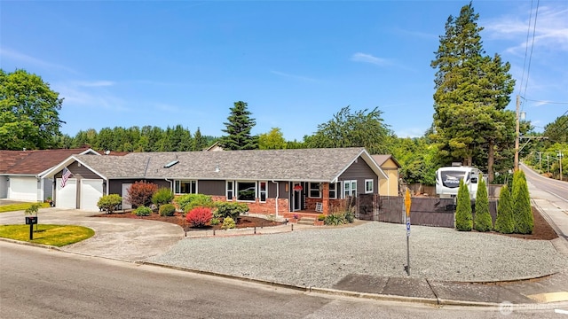 824 Orth Way, Sedro Woolley, WA 98284 - ranch-style home featuring a garage, concrete driveway, brick siding, and covered porch