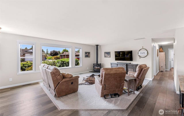 824 Orth Way, Sedro Woolley, WA 98284 - living area featuring a wood stove and wood-type flooring