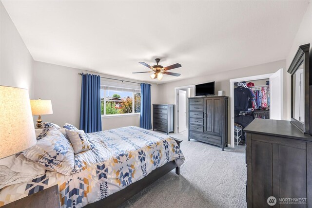 824 Orth Way, Sedro Woolley, WA 98284 - bedroom with light carpet, a walk in closet, a closet, and ceiling fan