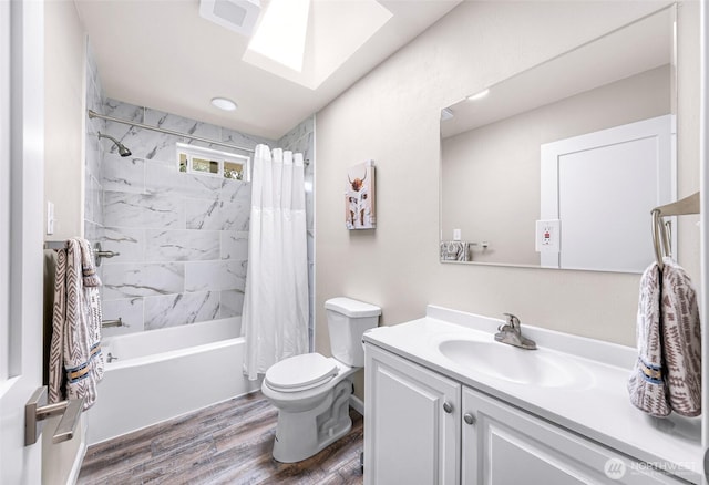 824 Orth Way, Sedro Woolley, WA 98284 - bathroom featuring a skylight, wood finished floors, vanity, and shower / tub combo