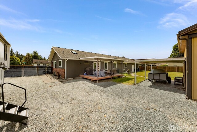 824 Orth Way, Sedro Woolley, WA 98284 - rear view of house featuring a fenced backyard and a wooden deck